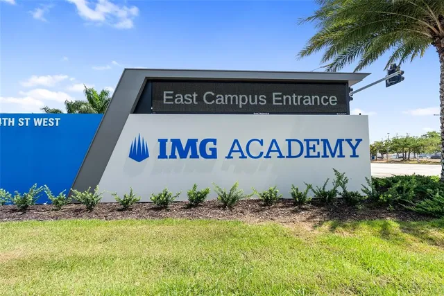 a sign that is sitting on a brick wall