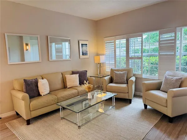 a living room with furniture and a large window