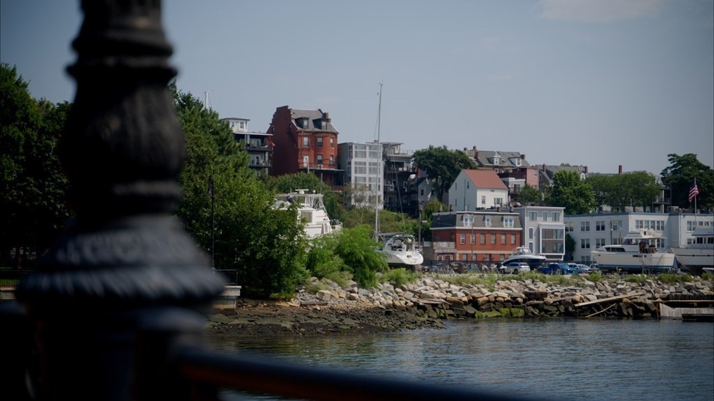 210 Marginal Street Boston, MA 02128 - Photo 1 of 36 a view of a lake with a building in the background
