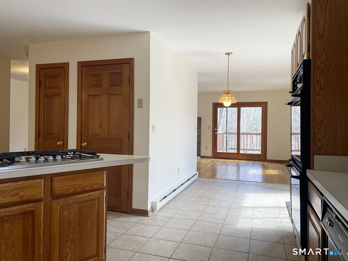 1315 Purchase Brook Road Southbury, CT 06488 - Photo 13 of 41 a view of a kitchen with a sink and a window