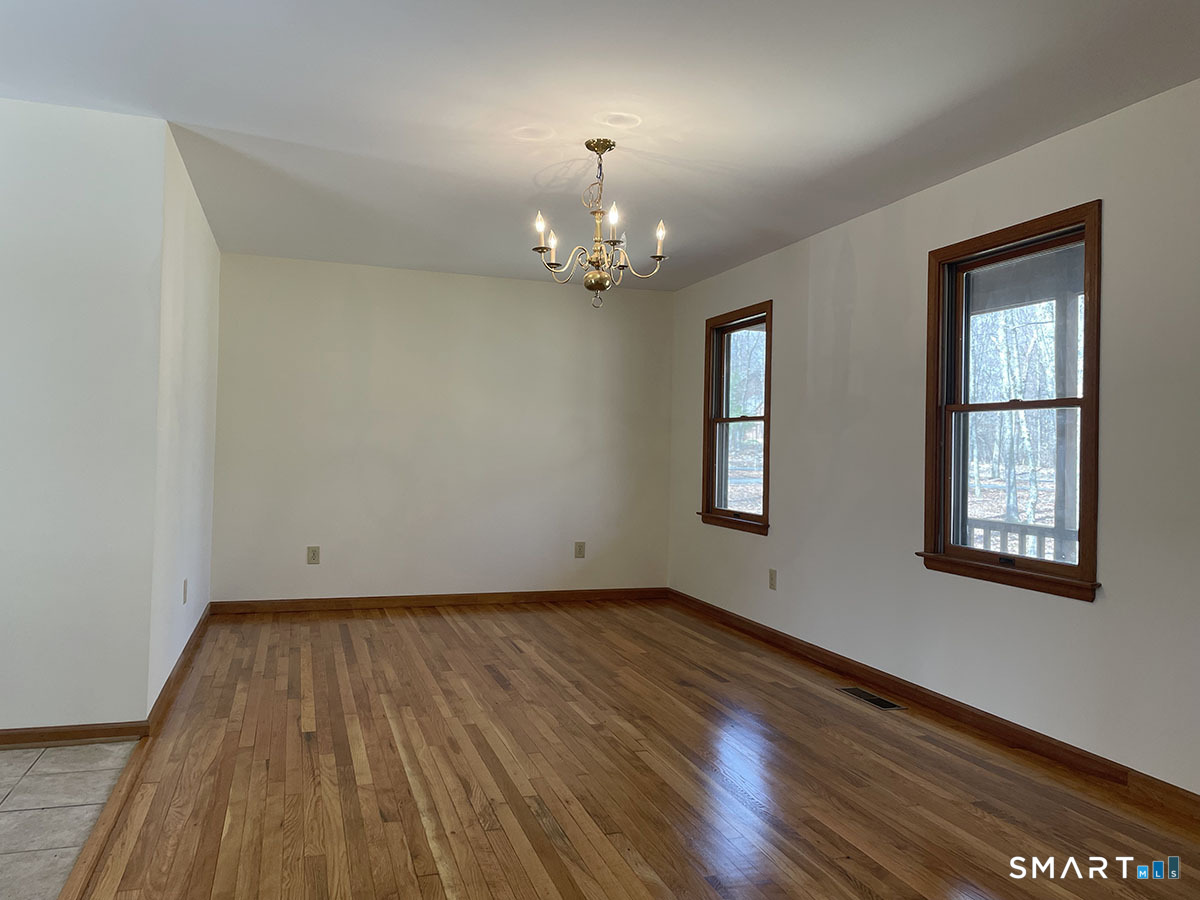 1315 Purchase Brook Road Southbury, CT 06488 - Photo 18 of 41 wooden floor in an empty room with a window