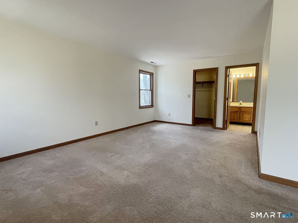 1315 Purchase Brook Road Southbury, CT 06488 - Photo 25 of 41 an empty room with windows and closet