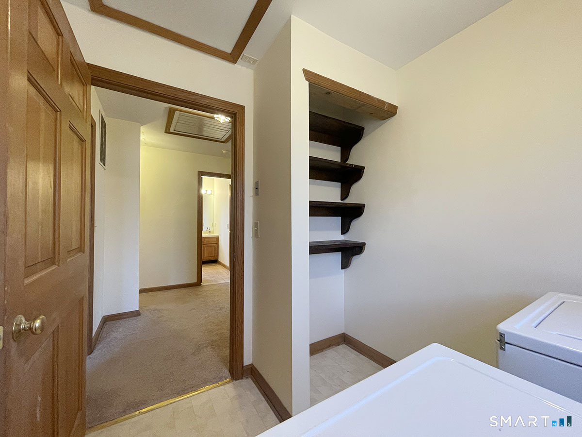 1315 Purchase Brook Road Southbury, CT 06488 - Photo 29 of 41 a view of a hallway with wooden floor and entryway