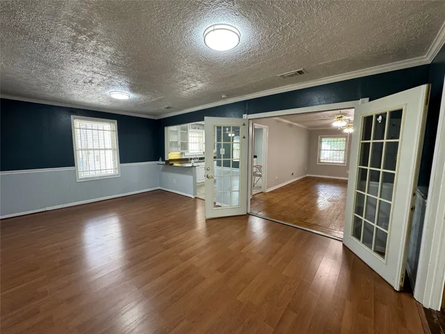 a kitchen with a refrigerator and a stove top oven