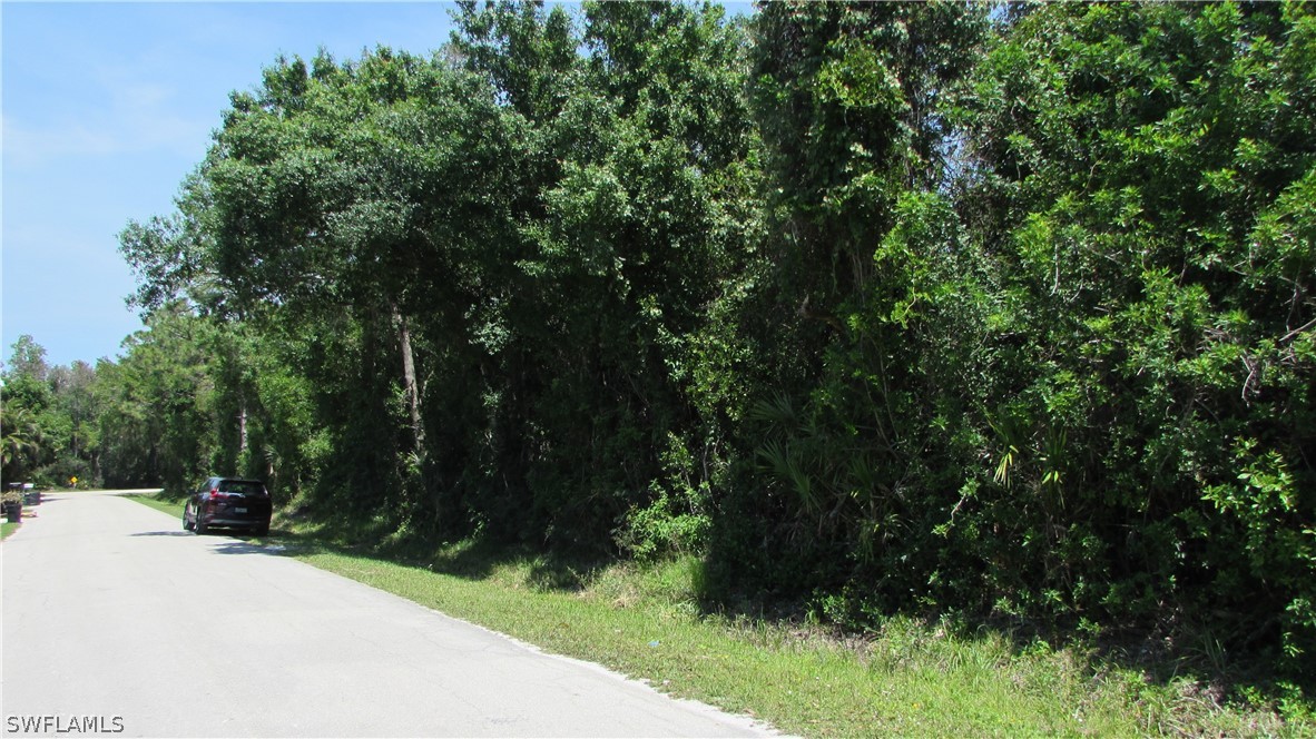 10894 Russell Road Bokeelia, FL 33922 - Photo 3 of 5 a view of a yard