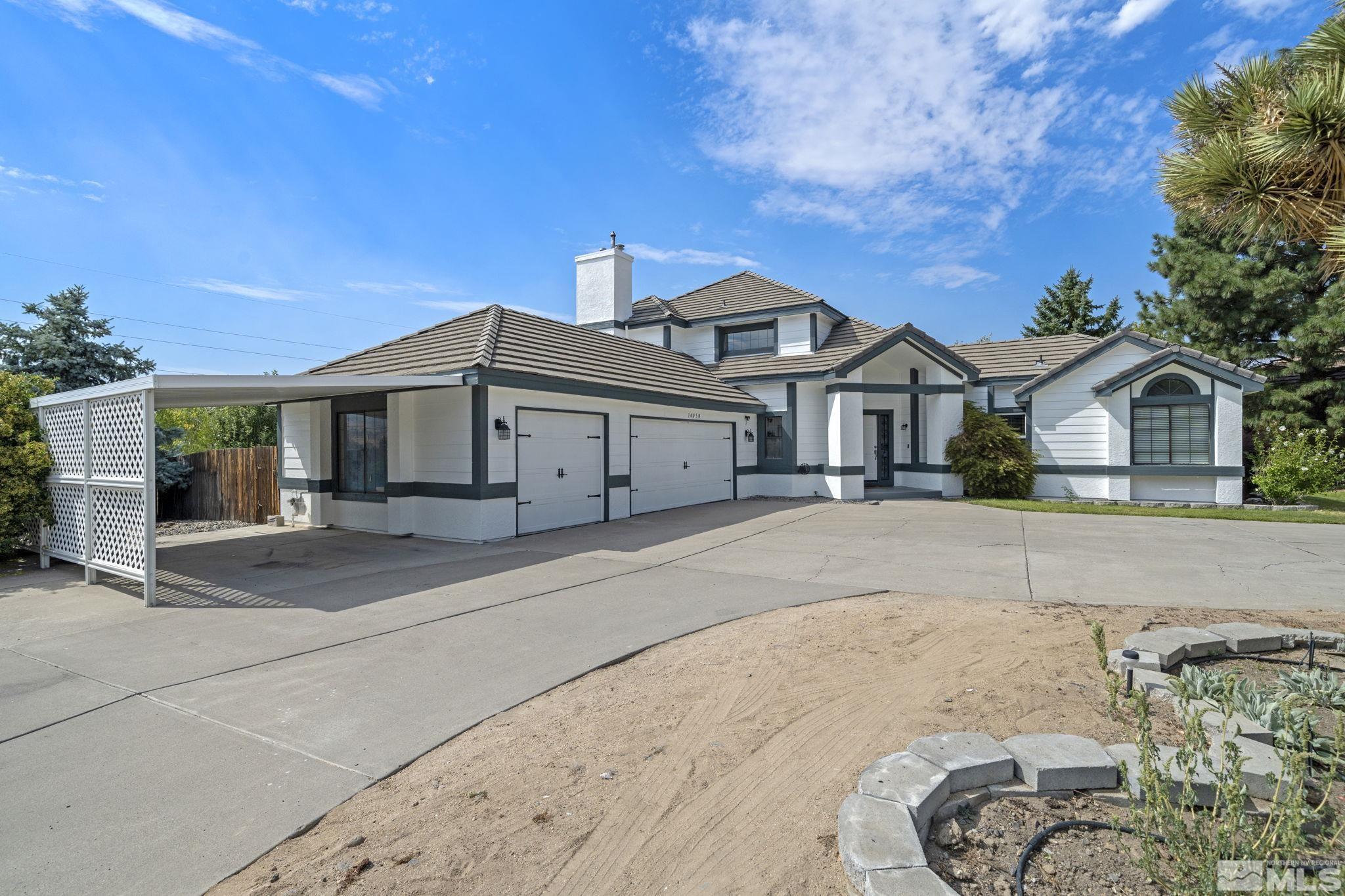 14050 Riata Circle Reno, NV 89521 - Photo 1 of 33 a front view of a house with a yard