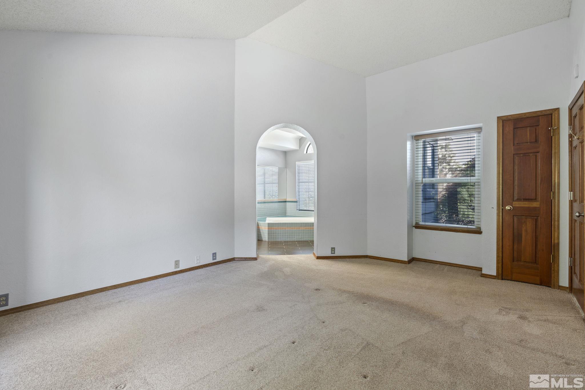 14050 Riata Circle Reno, NV 89521 - Photo 14 of 33 an empty room with windows and closet