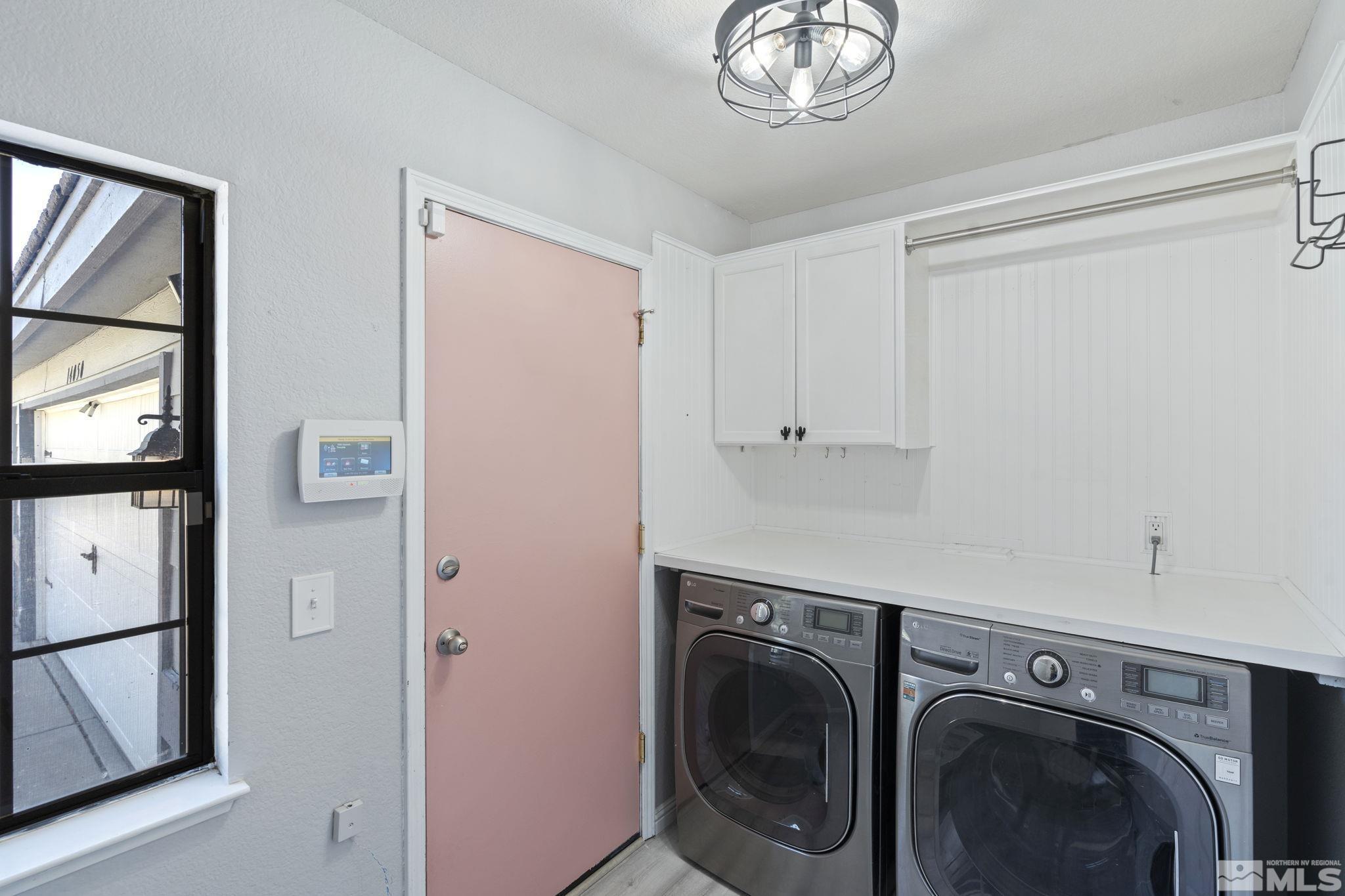 14050 Riata Circle Reno, NV 89521 - Photo 24 of 33 a utility room with dryer and washer