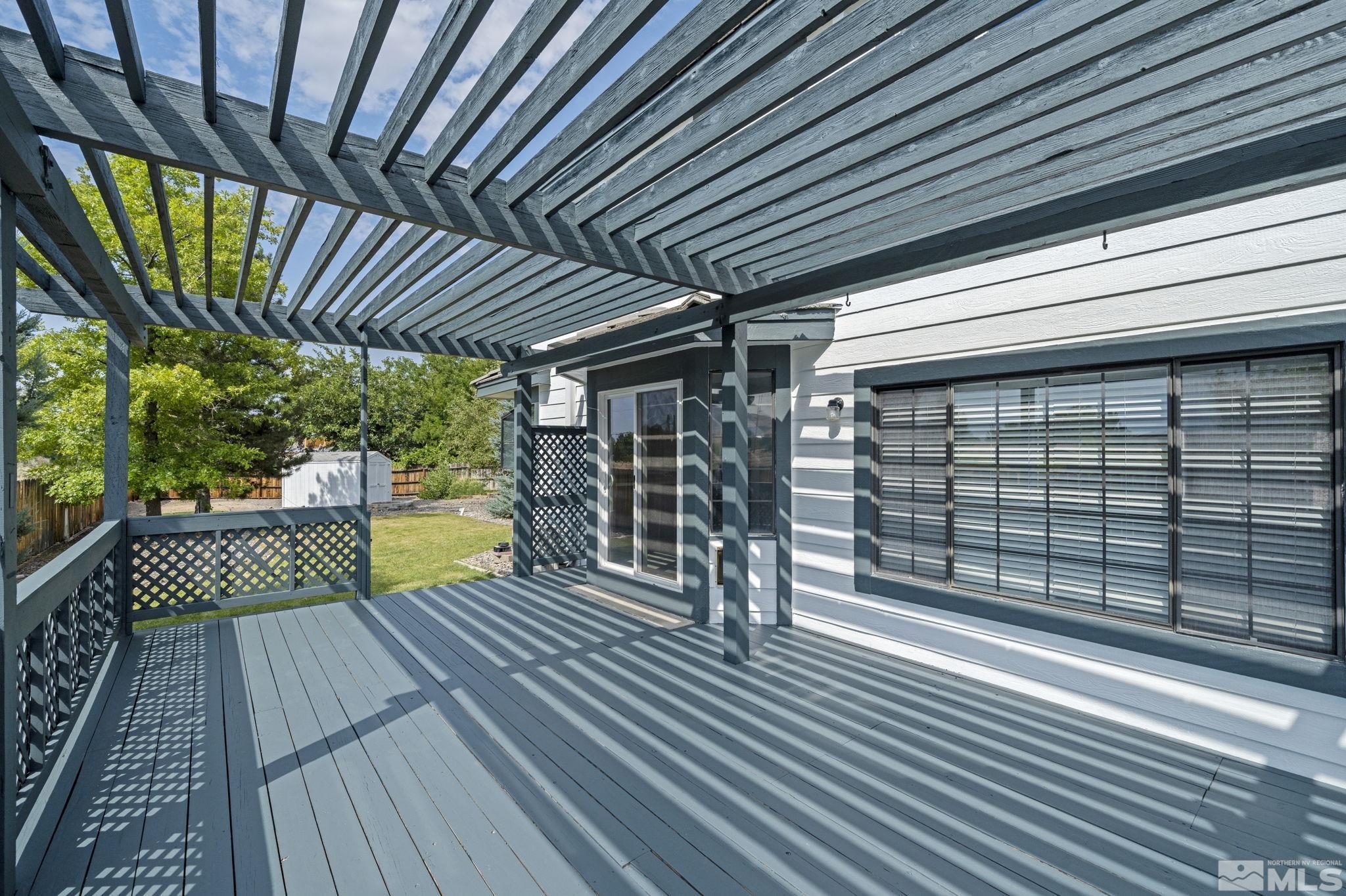 14050 Riata Circle Reno, NV 89521 - Photo 28 of 33 a view of a porch with wooden floor