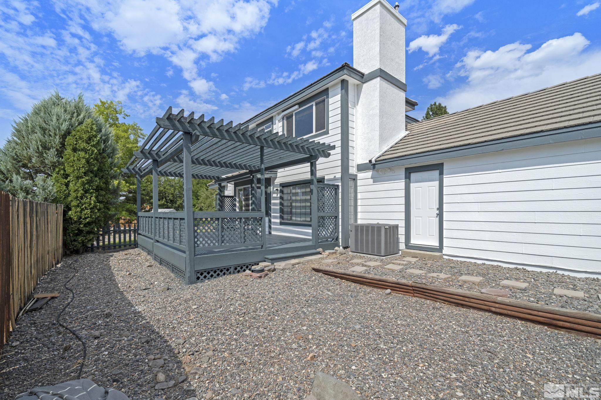 14050 Riata Circle Reno, NV 89521 - Photo 29 of 33 a front view of a house with a yard