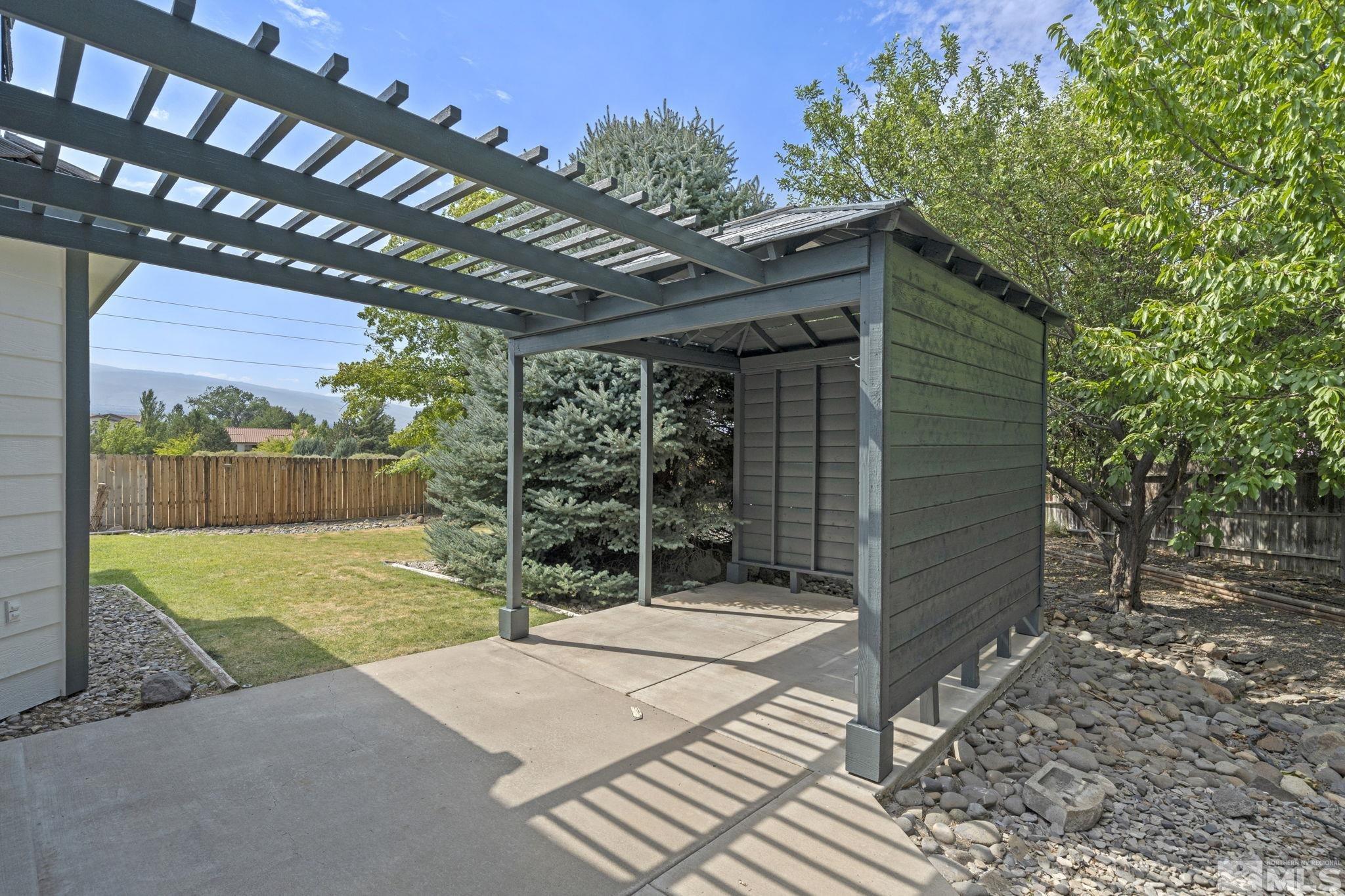 14050 Riata Circle Reno, NV 89521 - Photo 31 of 33 a view of a backyard with a tree