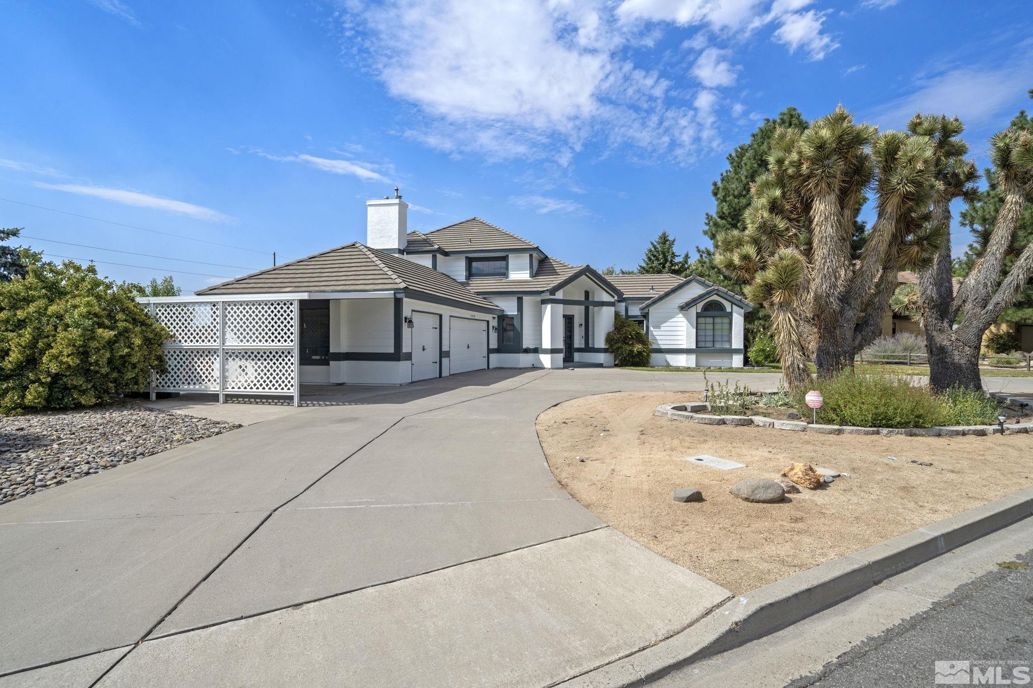 14050 Riata Circle Reno, NV 89521 - Photo 33 of 33 a front view of a house with a garden