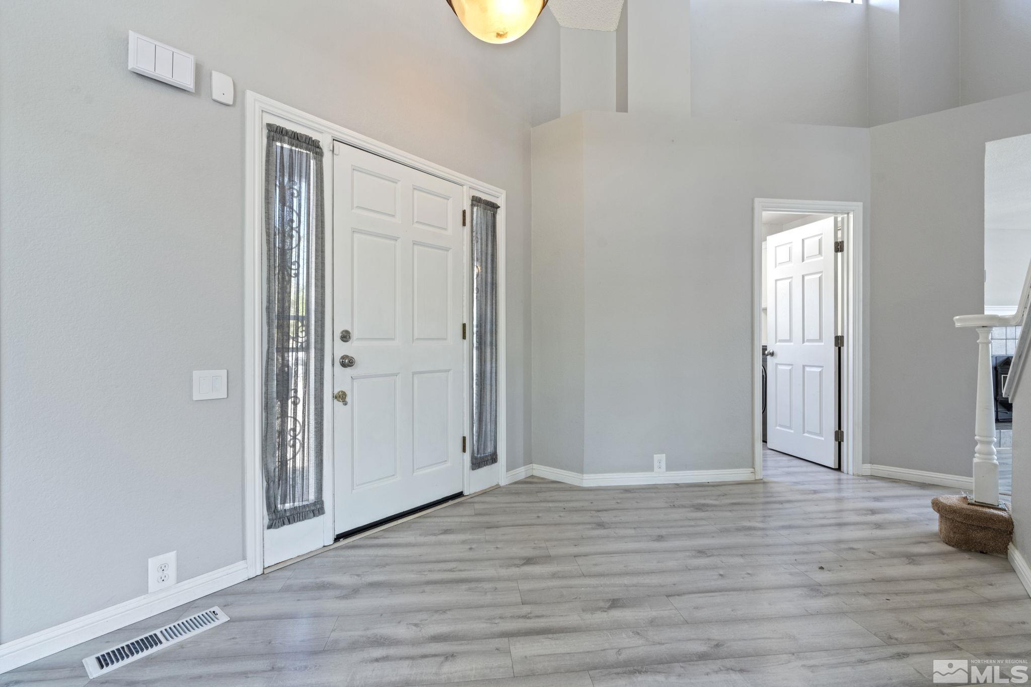 14050 Riata Circle Reno, NV 89521 - Photo 4 of 33 a view of entryway with wooden floor