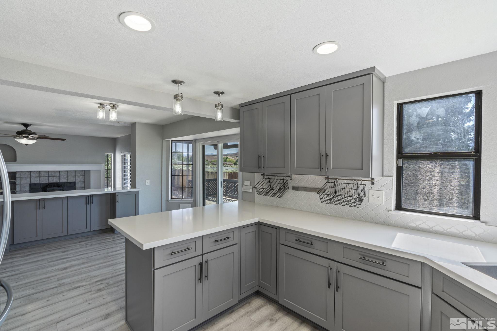 14050 Riata Circle Reno, NV 89521 - Photo 8 of 33 a kitchen with a sink and cabinets