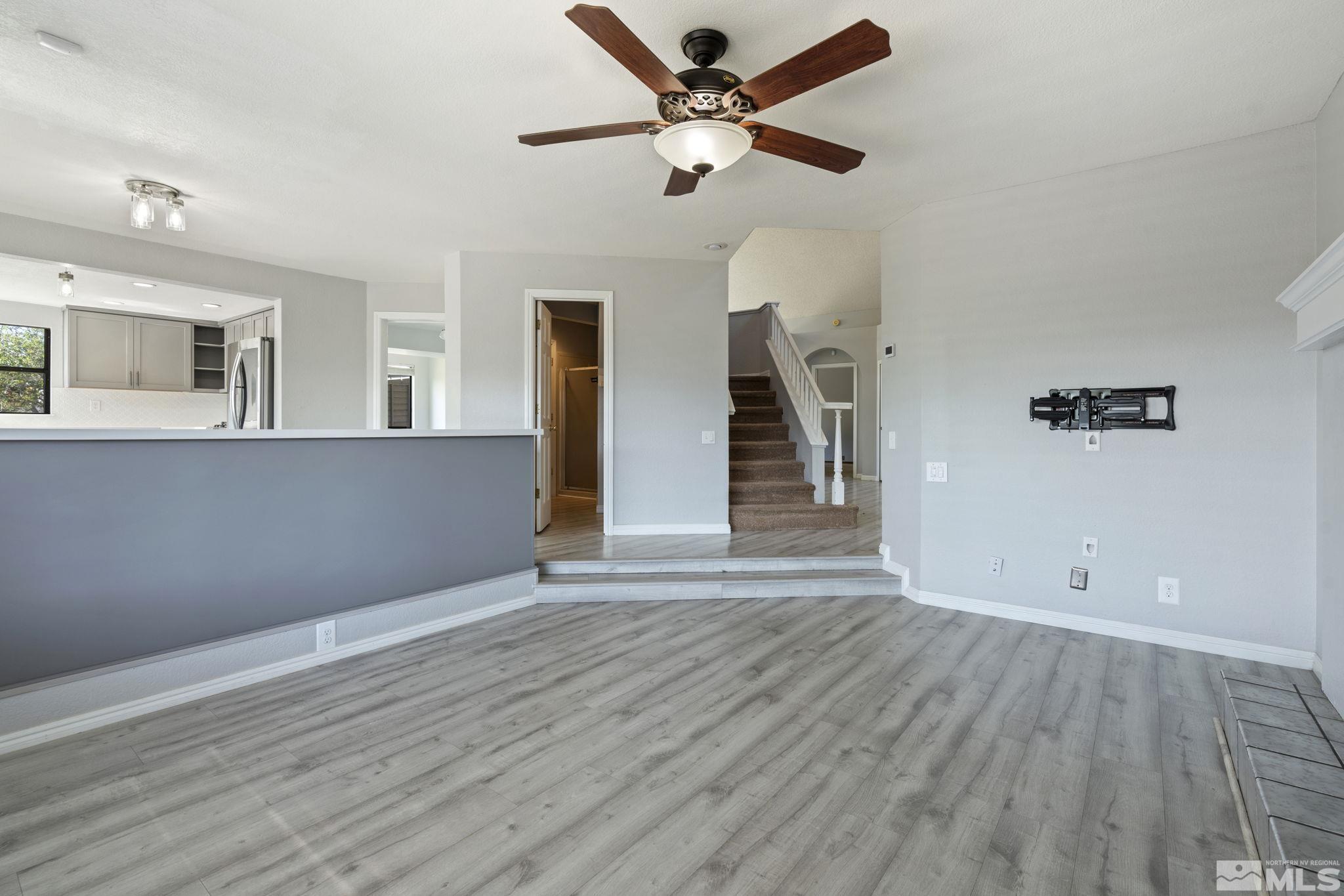 14050 Riata Circle Reno, NV 89521 - Photo 9 of 33 wooden floor in an empty room with a window