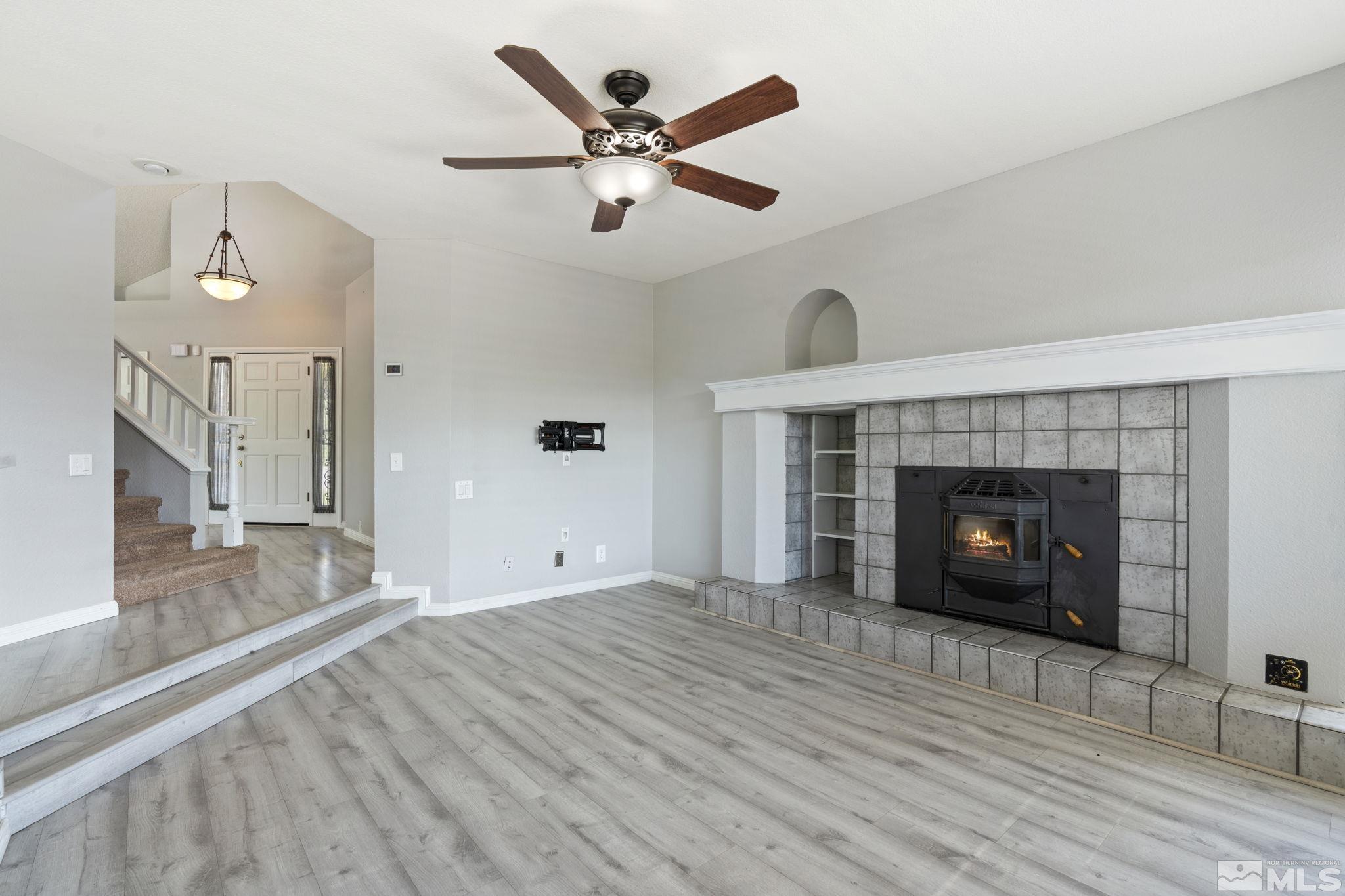 14050 Riata Circle Reno, NV 89521 - Photo 10 of 33 a living room with furniture and a fireplace
