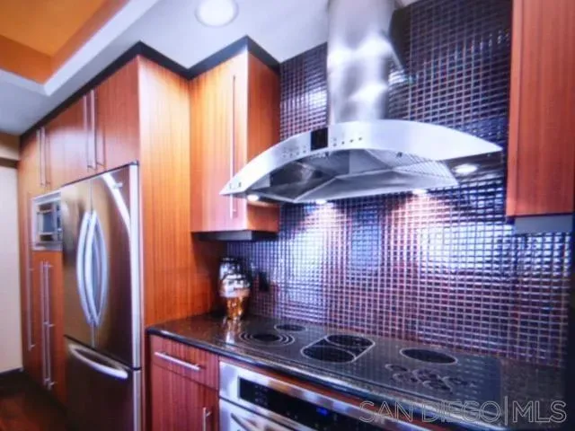 a kitchen with a sink cabinets and stainless steel appliances