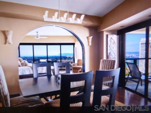 100 Harbor Drive, Unit 3404 San Diego, CA 92101 - Photo 14 of 30 a view of a dining room with furniture window and wooden floor