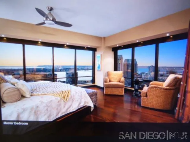 100 Harbor Drive, Unit 3404 San Diego, CA 92101 - Photo 16 of 30 a bedroom with a large window and a balcony