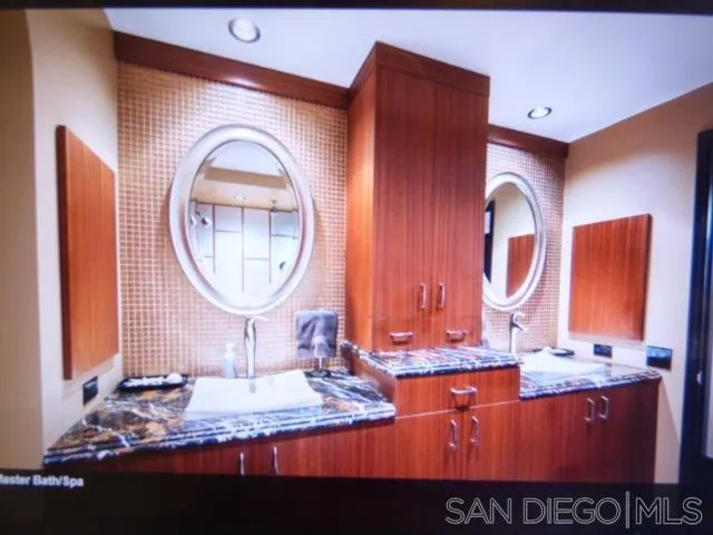 100 Harbor Drive, Unit 3404 San Diego, CA 92101 - Photo 20 of 30 a bathroom with a sink and a mirror