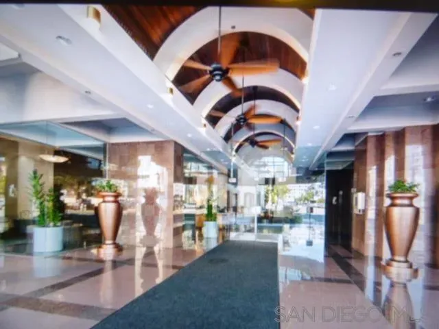 a hall with lots of dining table and chairs