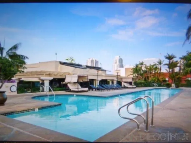 an aerial view of a house with swimming pool garden and outdoor seating