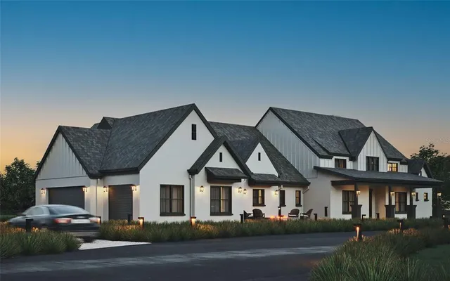 a front view of multiple houses with yard