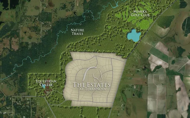 a sign that is sitting on a wall next to a lake