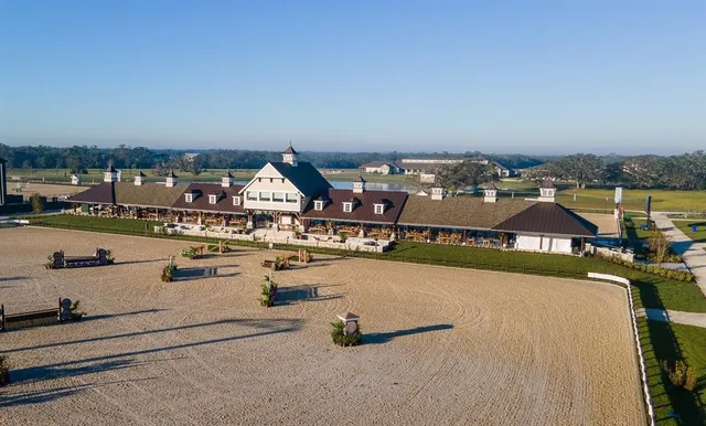 an aerial view of a house with outdoor space