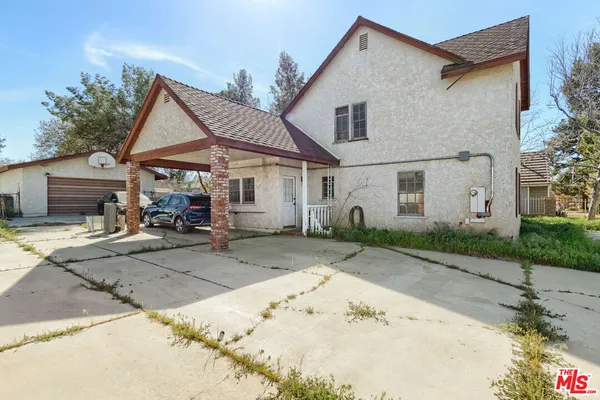 a view of a house with a patio