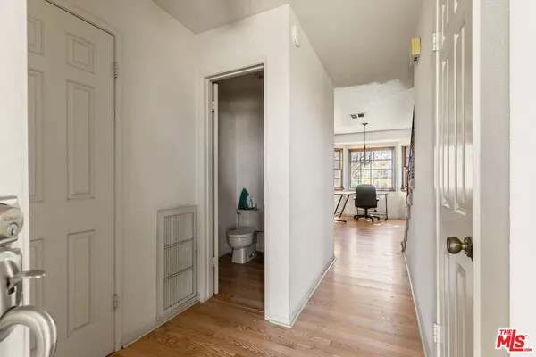 a view of a bedroom from a hallway