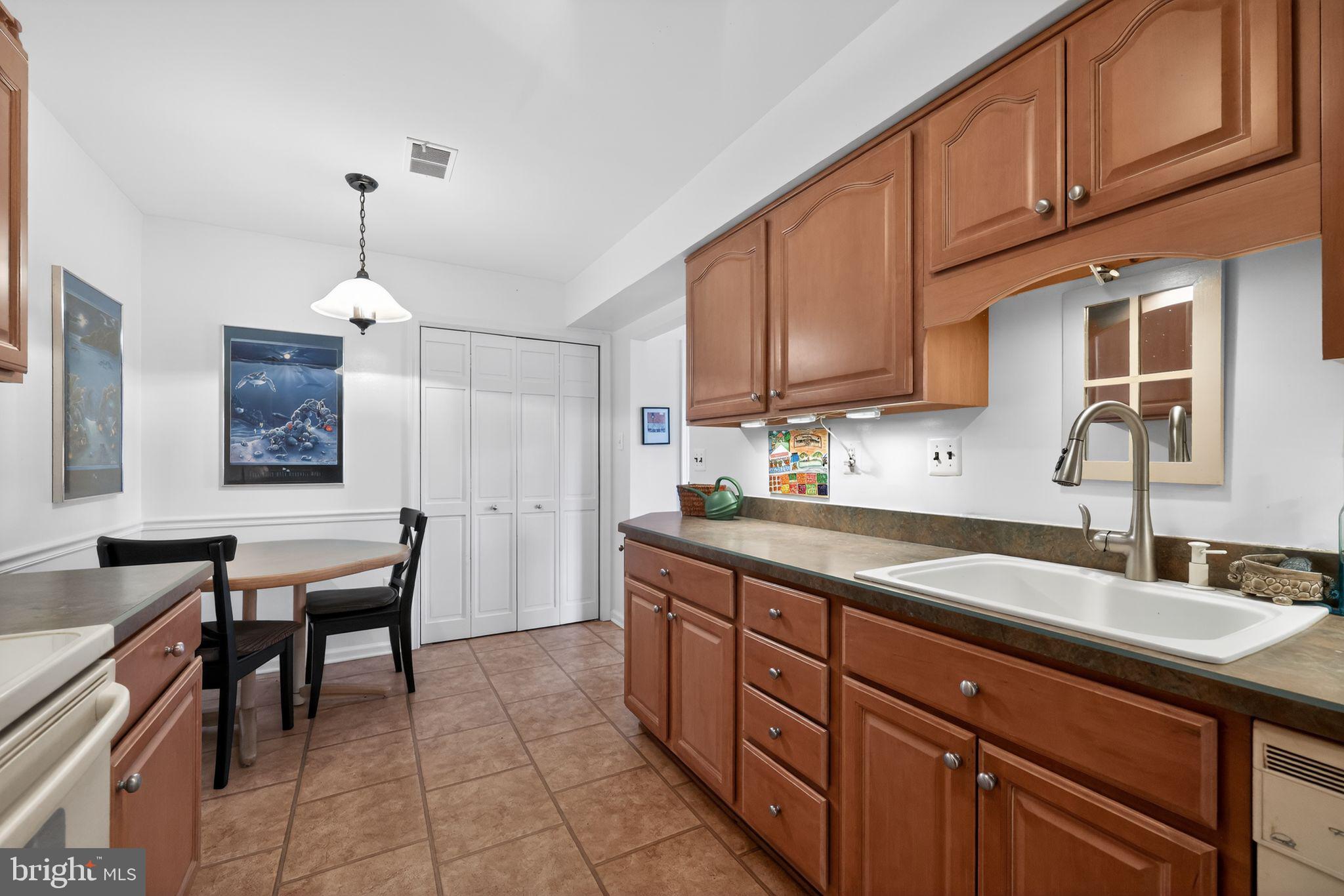 213 Haddonfield Cmns, Unit 213 Haddonfield, NJ 08033 - Photo 14 of 35 Charming kitchen with warm wood tones.