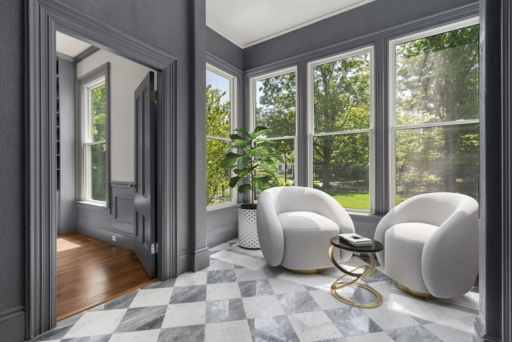 45 Islington Road Newton, MA 02466 - Photo 17 of 41 a living room with furniture and a floor to ceiling window