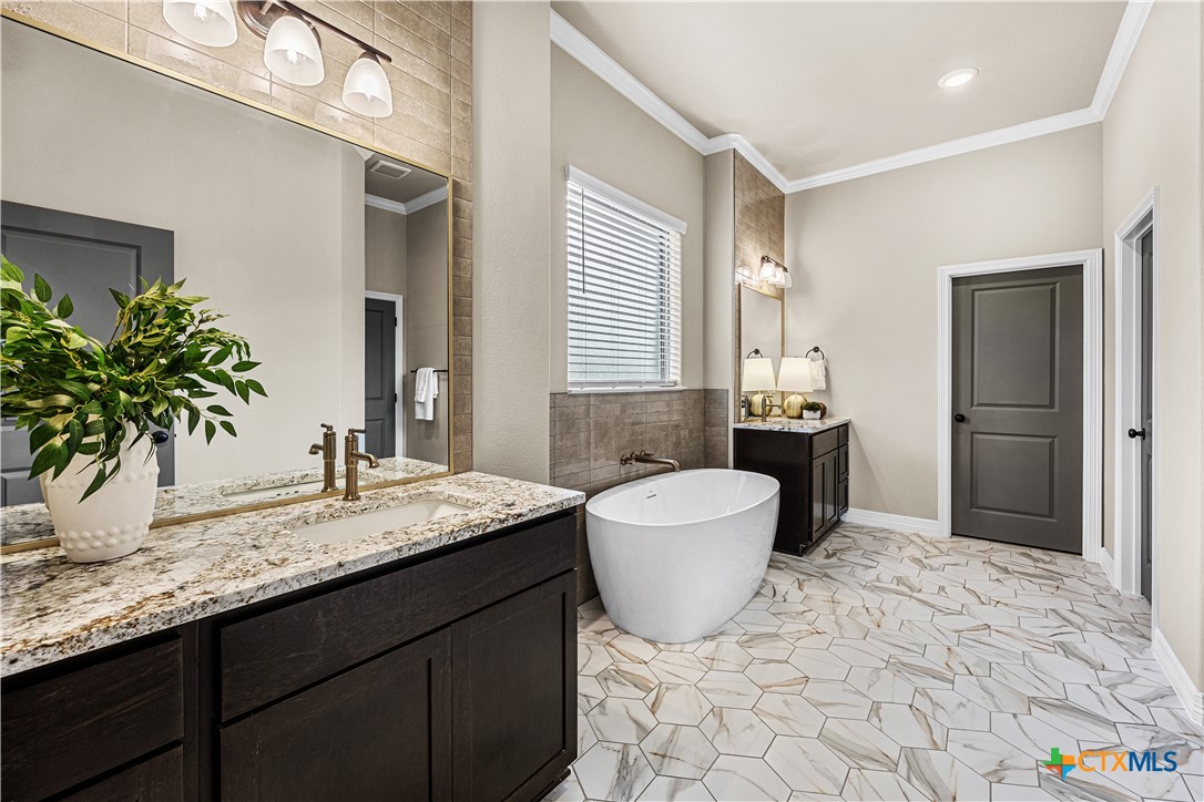 2136 Oak Draw Court Belton, TX 76513 - Photo 20 of 46 a bathroom with a granite countertop sink and a mirror