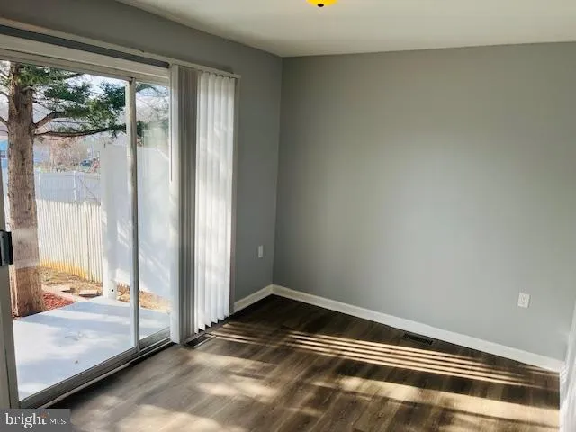 a view of room with furniture and windows