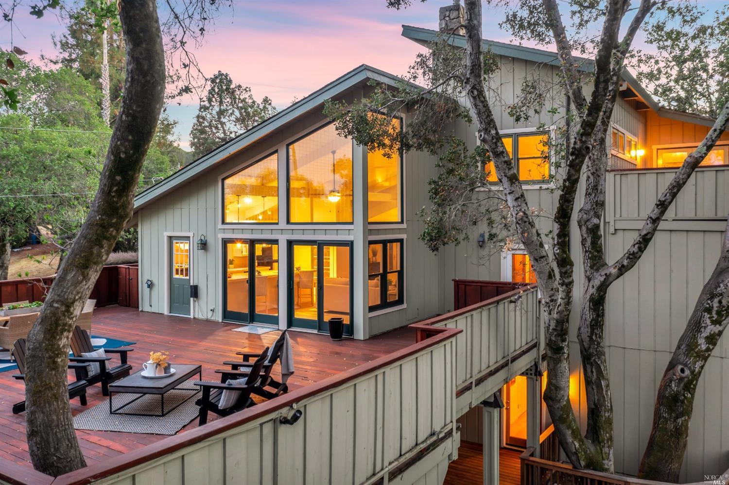 551 Amber Way Petaluma, CA 94952 - Photo 1 of 1 a view of a house with large windows and a small yard
