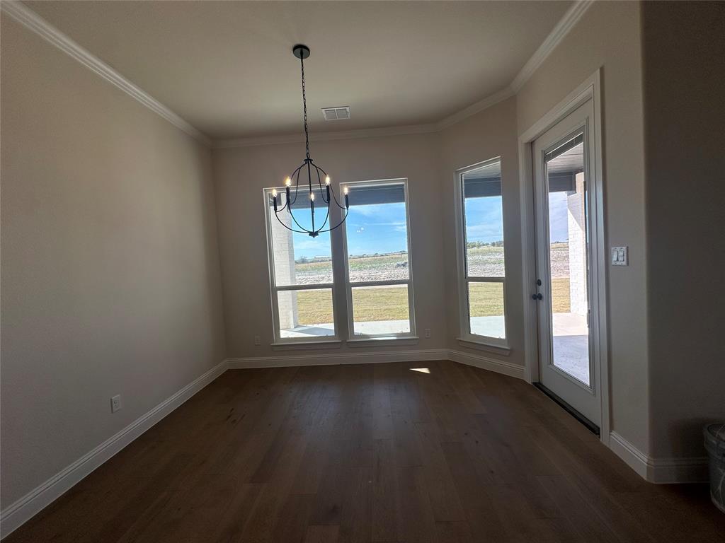 108 Blackstar Lane Decatur, TX 76234 - Photo 16 of 37 a view of an empty room with wooden floor and a window