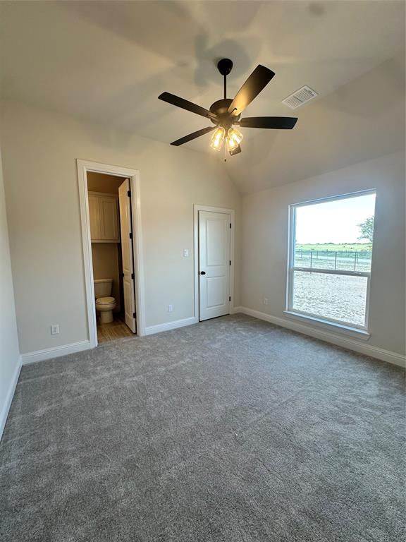 108 Blackstar Lane Decatur, TX 76234 - Photo 18 of 37 an empty room with windows and fan