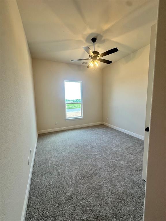 108 Blackstar Lane Decatur, TX 76234 - Photo 23 of 37 an empty room with a window and a fan