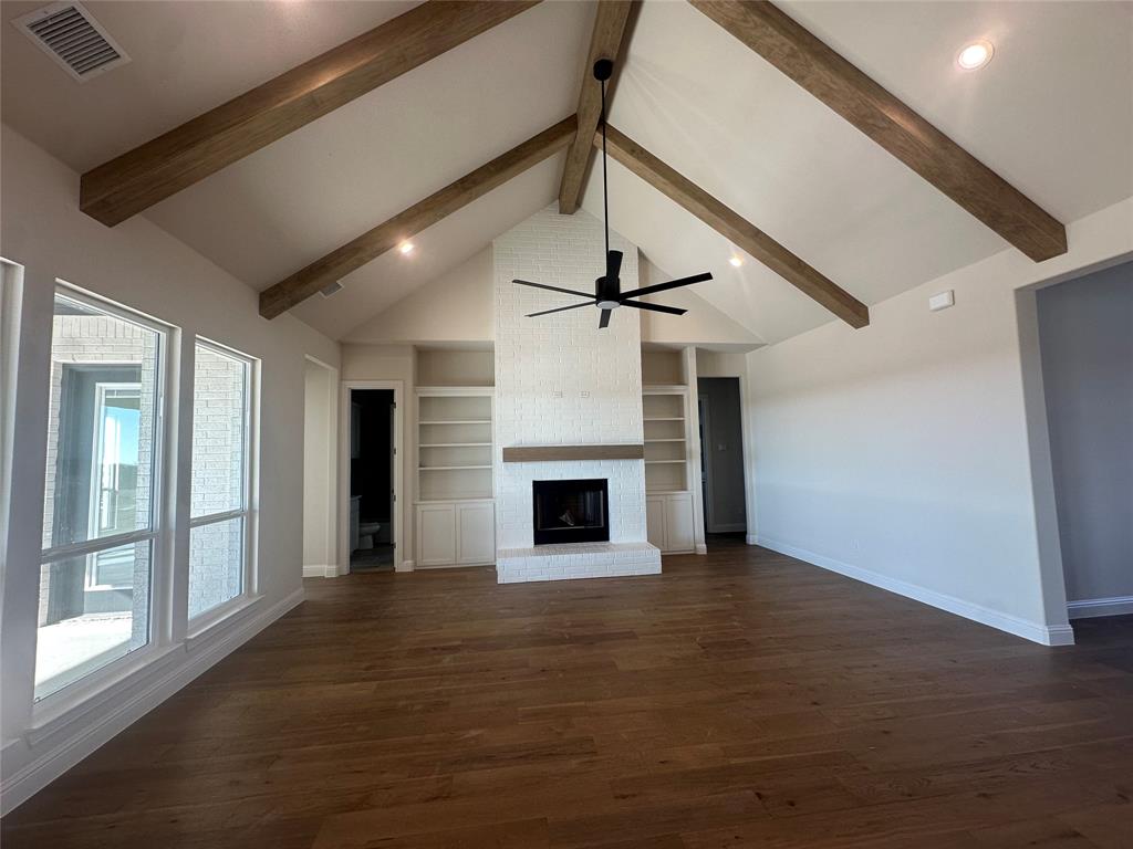 108 Blackstar Lane Decatur, TX 76234 - Photo 9 of 37 a view of a livingroom with a fireplace and window