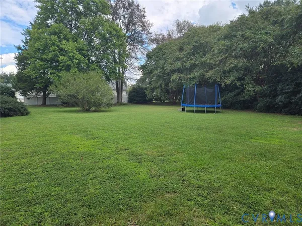a backyard of a house with lots of green space