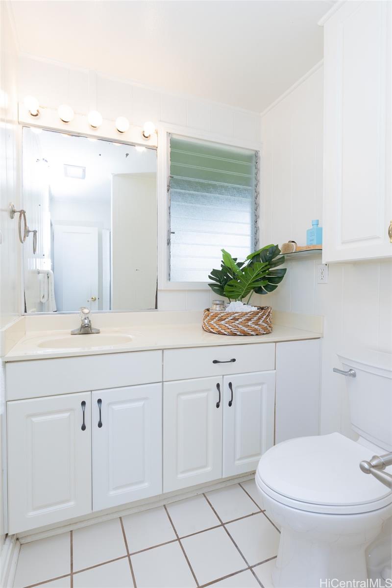 176 Kuulei Road Kailua, HI 96734 - Photo 12 of 25 There are two full bathrooms on the left wing of the home amongst the three bedrooms.
