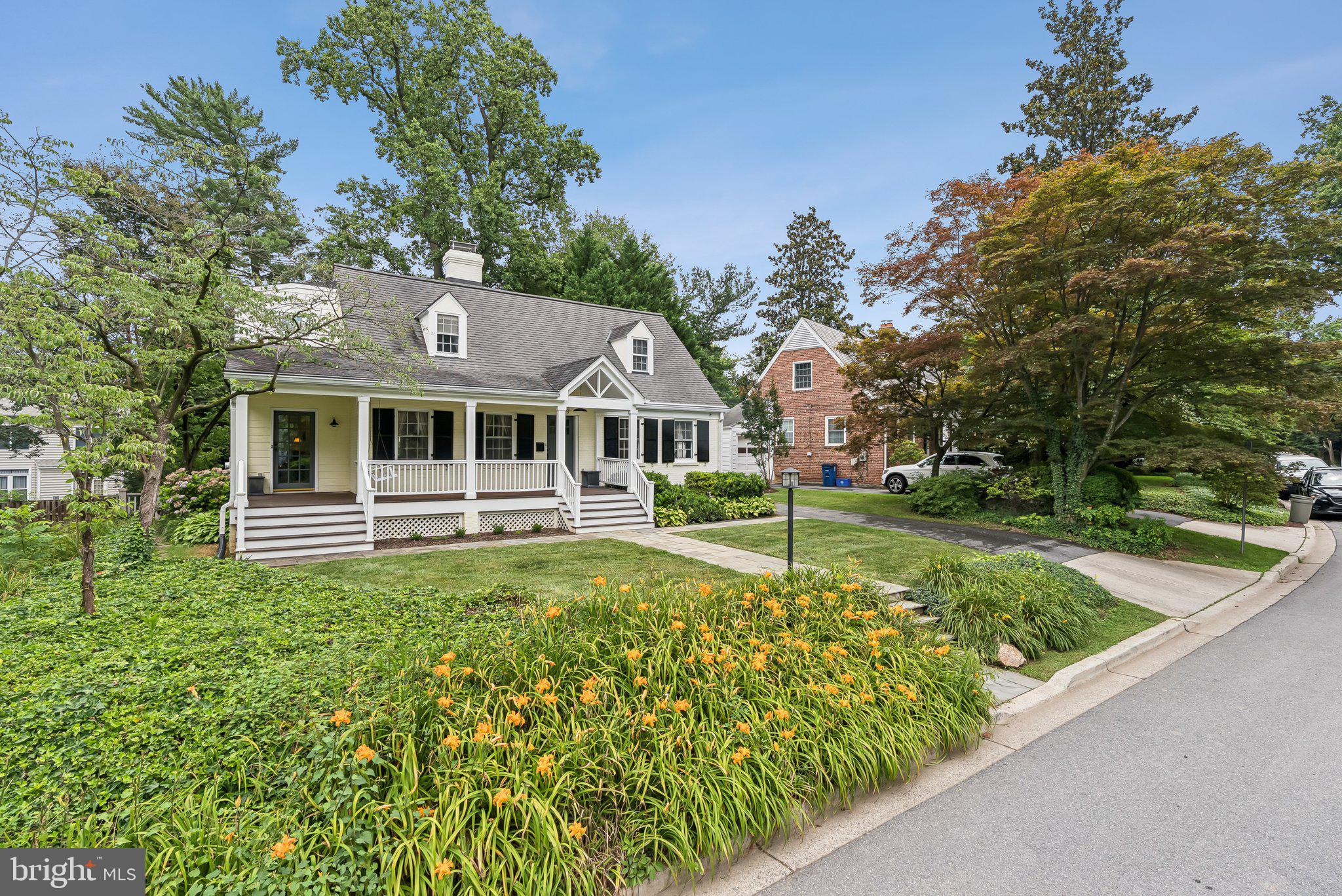 8109 Custer Road Bethesda, MD 20814 - Photo 2 of 54 a view of a house with a swimming pool
