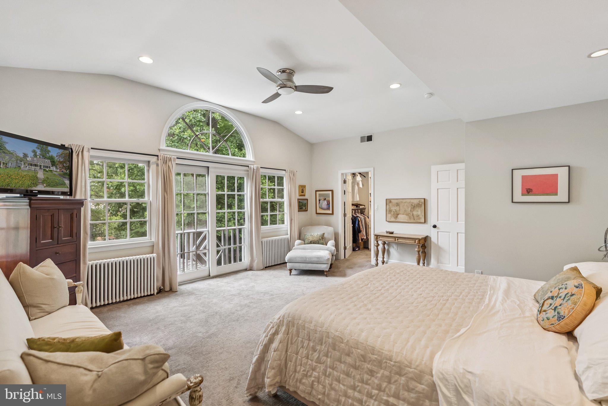 8109 Custer Road Bethesda, MD 20814 - Photo 23 of 54 a spacious bedroom with a bed and a large window