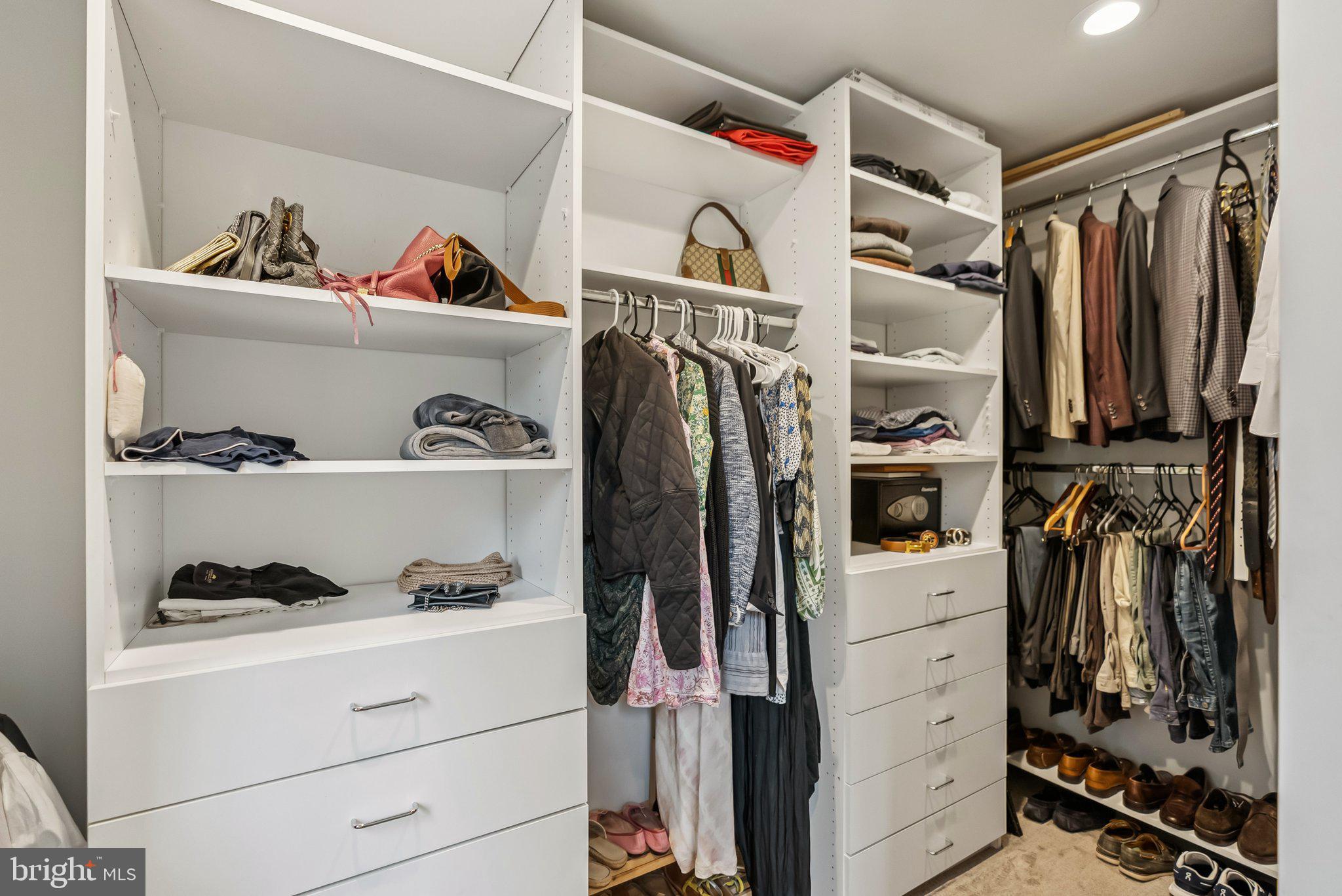 8109 Custer Road Bethesda, MD 20814 - Photo 24 of 54 a view of walk in closet with clothes and shoes