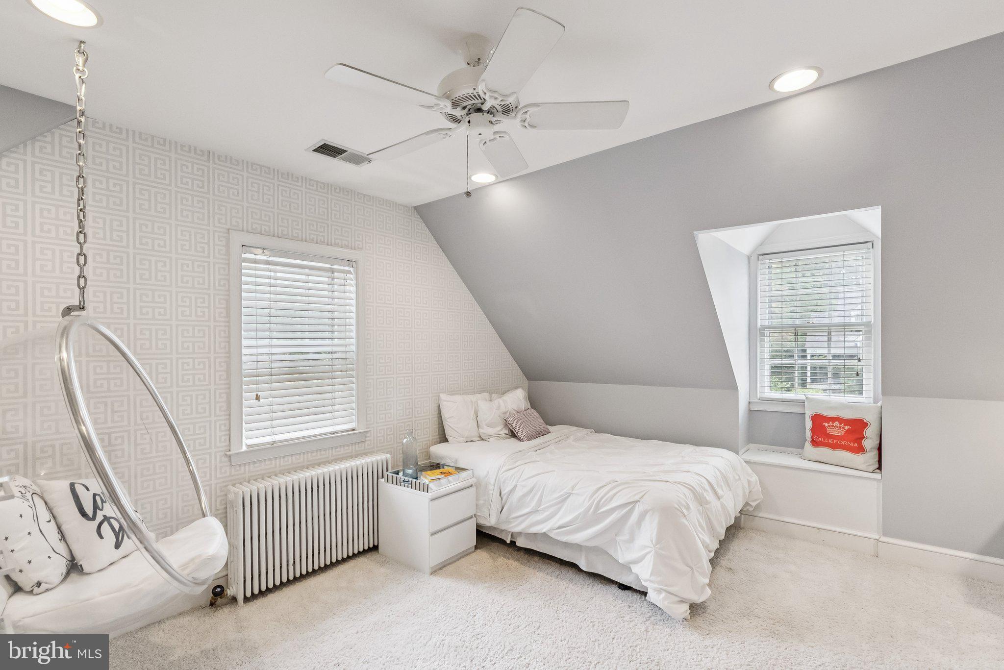 8109 Custer Road Bethesda, MD 20814 - Photo 32 of 54 a spacious bedroom with a bed and a window