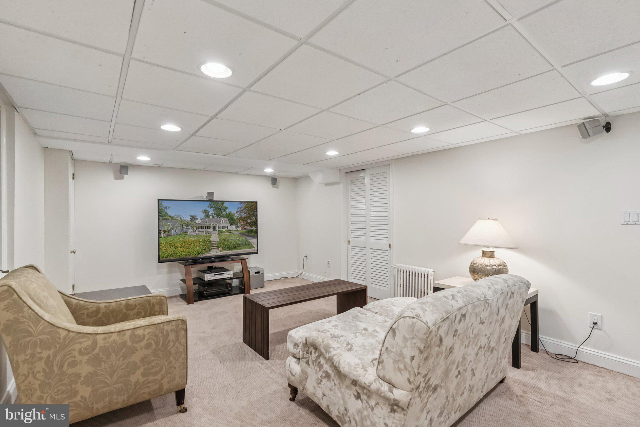 8109 Custer Road Bethesda, MD 20814 - Photo 41 of 54 a bedroom with furniture and a flat screen tv