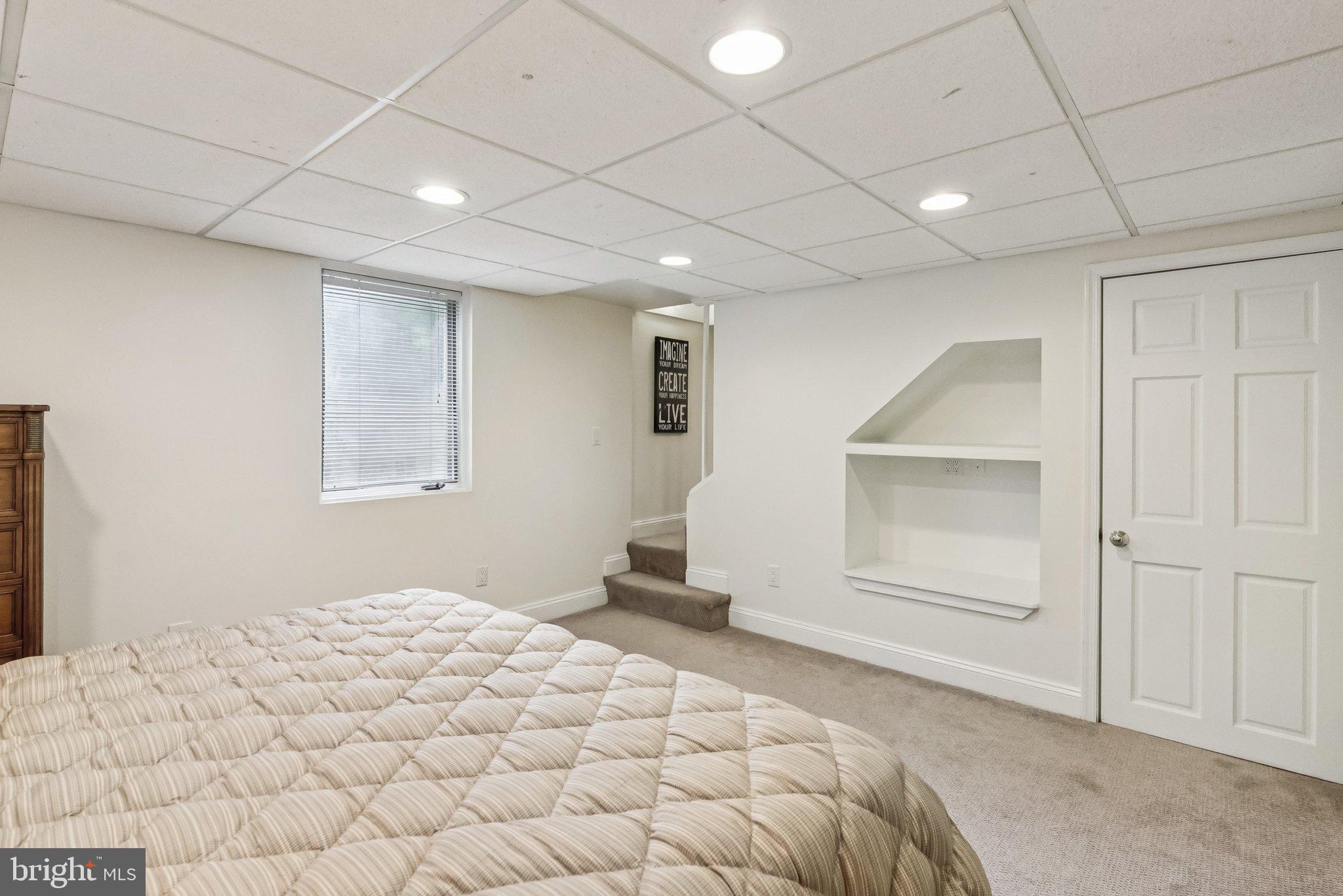 8109 Custer Road Bethesda, MD 20814 - Photo 43 of 54 a bedroom with a bed and a window