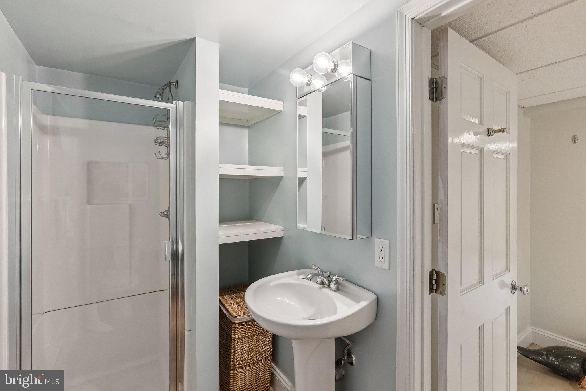 8109 Custer Road Bethesda, MD 20814 - Photo 46 of 54 a bathroom with a sink toilet and shower