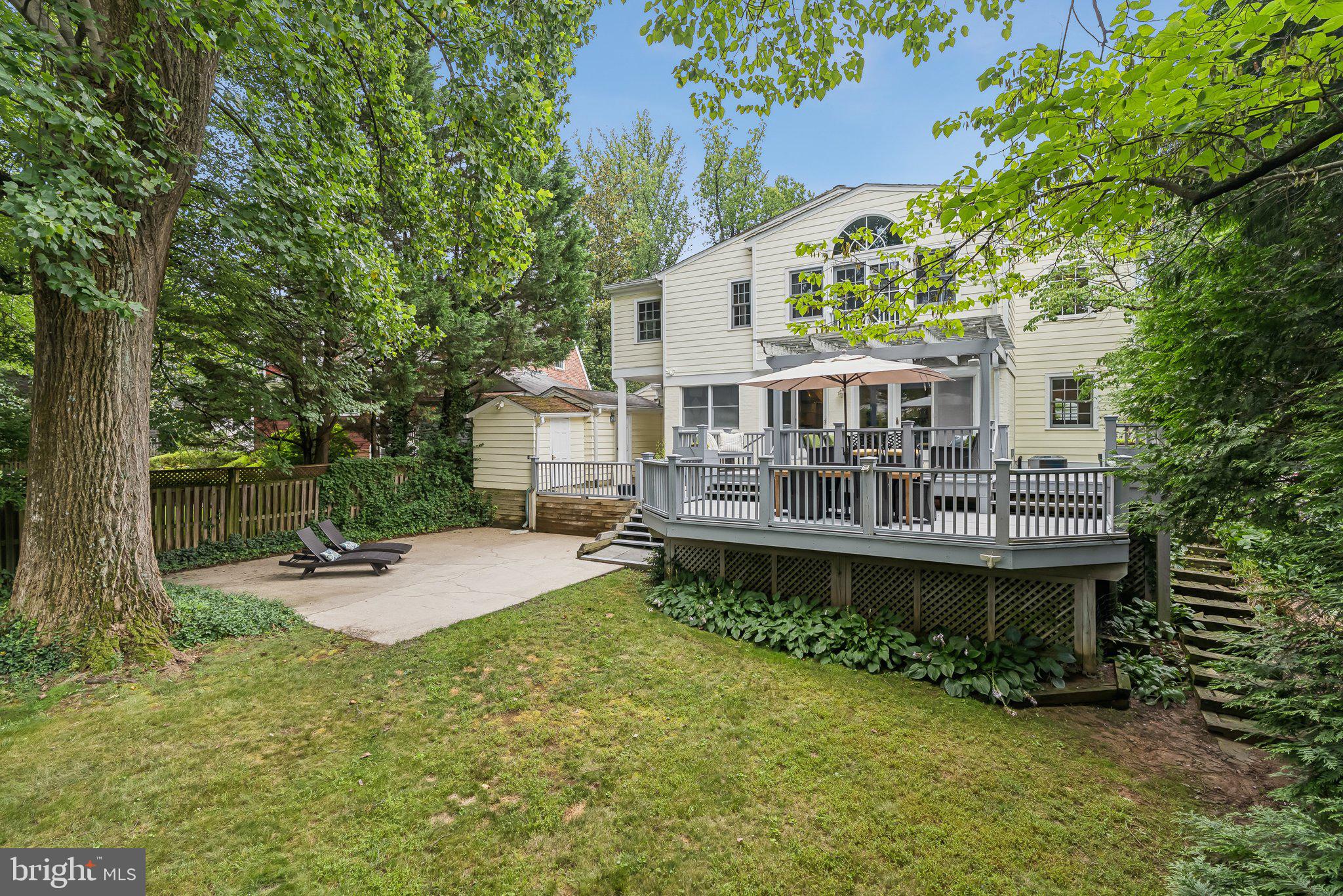 8109 Custer Road Bethesda, MD 20814 - Photo 49 of 54 a view of a house with a yard and sitting area
